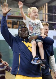 West Virginia football players join kids for Mini Day of Play